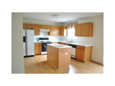 Kitchen. Breakfast area sits between kitchen and family room