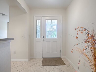 A leaded-glass door, and tile floors in the create