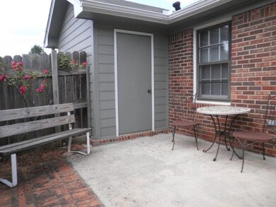 The private, backyard patio space adjoins the storage space.
