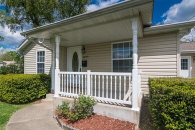 The covered front porch would be perfect for a bench or rocking chair and to welcome family and friends to your home.