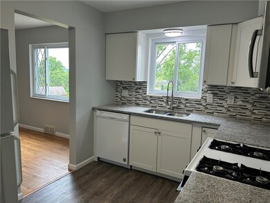 Updated white shaker cabinets, granite, and LVT fl