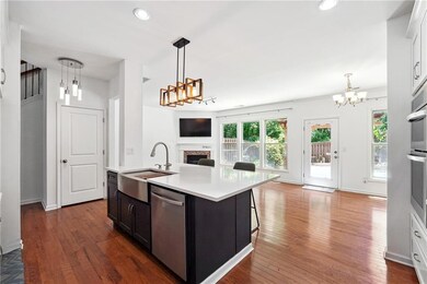 Kitchen with a sink, stainless steel dishwasher, a