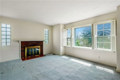 Living Room with wood burning fire place.