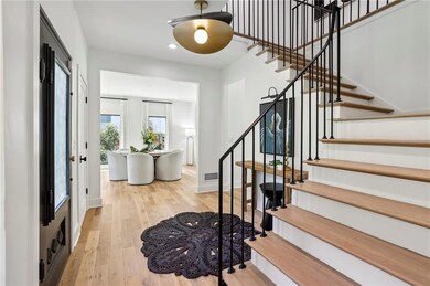 Entryway featuring stairs, wood-type flooring, rec