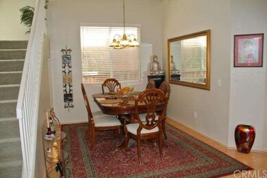 Spacious formal dining has a volume ceiling.