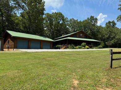 Surrounding community featuring a lawn and an outb