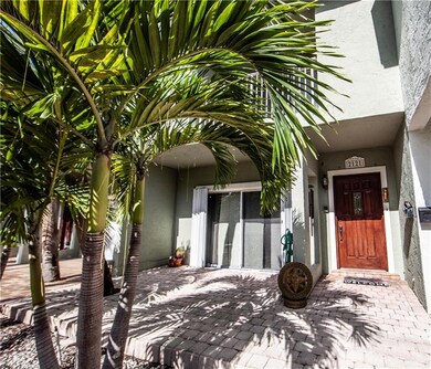 Front door and under cover patio of unit 11