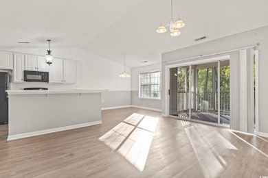 Interior space featuring a chandelier, light wood-