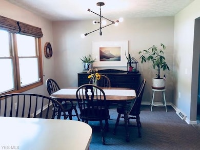 Dining room off kitchen, also showing the drop down counter, adding another eating area