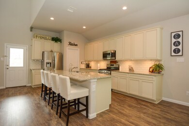 Kitchen features a large walk in kitchen