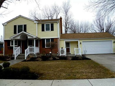 Exterior Front. Professional landscaping, double w