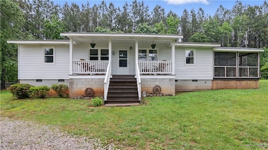 Back of property featuring crawl space, a yard, a