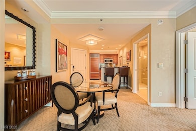 Dining area featuring crown molding and light colo