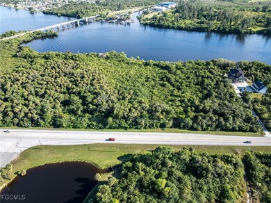 Bird's eye view of a nearby body of water and a notable bridge