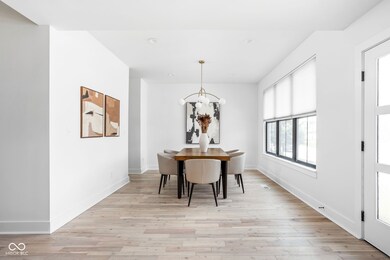dining space featuring a chandelier, light wood-style floors, and recessed lighting