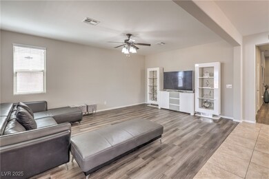 Living area with wood finished floors, visible ven