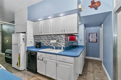 Entering into the kitchen from the formal living r