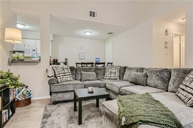 Living room featuring wood finished floors and ba
