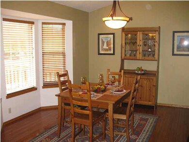 Dining area with hardwood flooring
