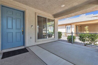 Doorway to property featuring stucco siding