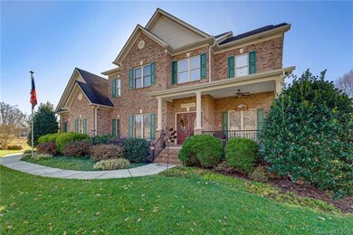 Full Brick exterior with maintenance free vinyl trim and soffits.  Lovely front porch to enjoy the waterview of LKN.  Extensive landscape all around the home.