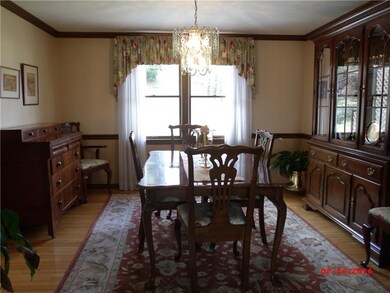 Formal diningroom with hardwood flooring, chair ra