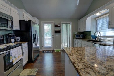 Large stunning kitchen with painted cabinets, hard