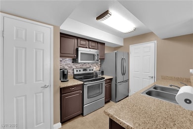 Kitchen featuring appliances with stainless steel