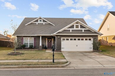 Don't be fooled!  This home's floor plan is spacious, open & is an entertainer's dream!  Big upstairs bonus room with full bar!  Great for Game day, Movie Nights or an In-law Suite!