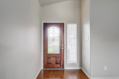 Foyer has plenty of room to place a cubby bench for everyone's shoes