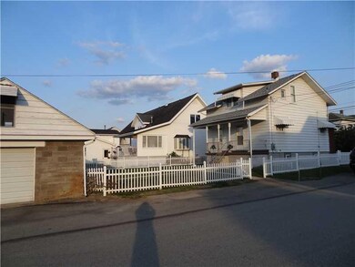 Exterior Back. The back porch exits to the level y