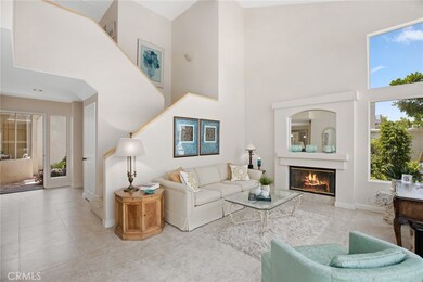 Vaulted ceilings, neutral colors and open floor plan.