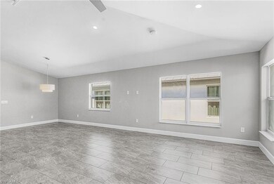 Spare room featuring baseboards and recessed lighting