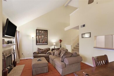 Vaulted ceilings and steps to upstairs bedroom and