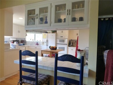 Lower kitchen and eating counter with glass door c