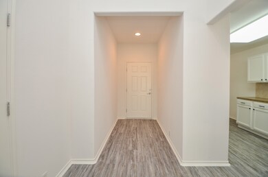 Entry hallway that leads into an open concept home
