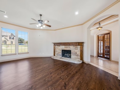Living room features a fireplace.