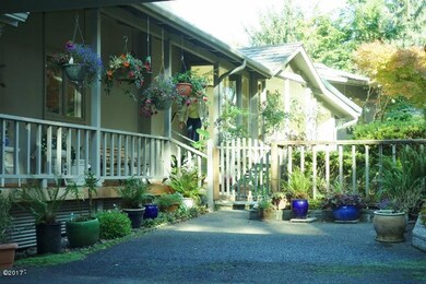 Covered Porch & Hanging Baskets