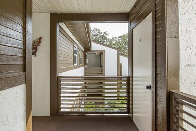 Covered front patio, with storage on the right.