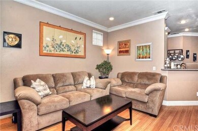 Another view of the quaint living room which is ad