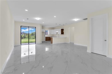Unfurnished living room featuring sink
