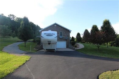 Side view, garage in basement & walk in door, as w