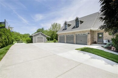 Oversized 3 car finished garage with 8’ doors