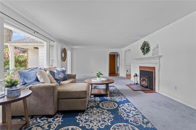 Living room with wood stove and large picture wind