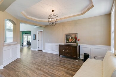 As you walk in the front door, the Dining Room has a spacious, open feel with views through the house of the back yard oasis in the distance.