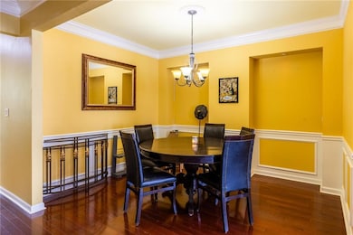 Dining space featuring an inviting chandelier, woo
