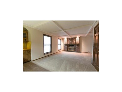 Spacious area with new carpet, wood burning firepl
