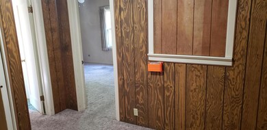 Alcove hallway leading to bedrooms & bat