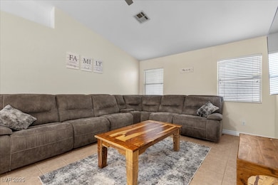Living room with light tile patterned floors, loft