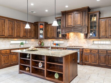 Kitchen featuring pendant lighting, visible vents